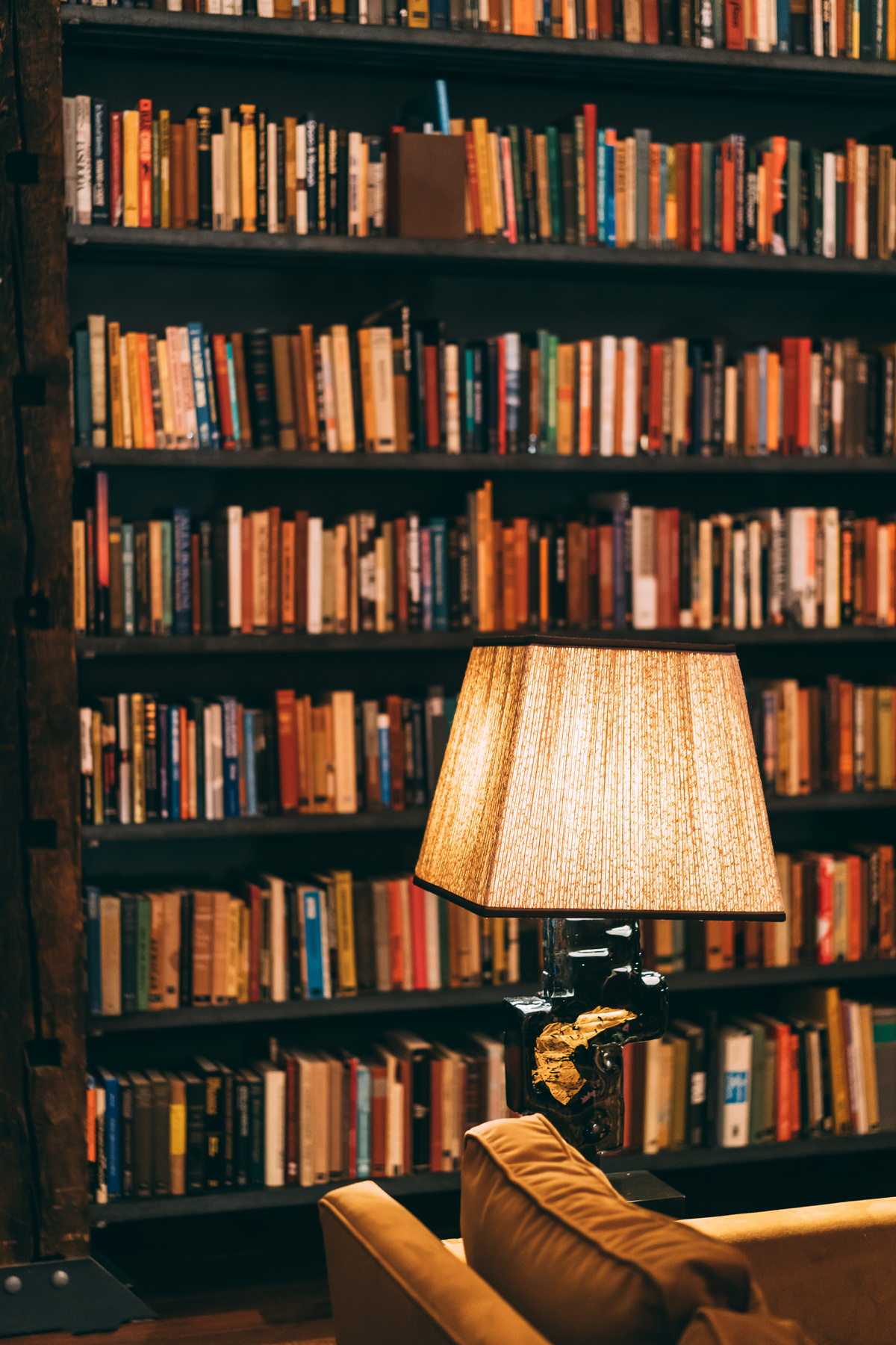 Table Lamp Near Bookshelves